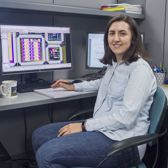 photo of Zahra Fahimi at her desk