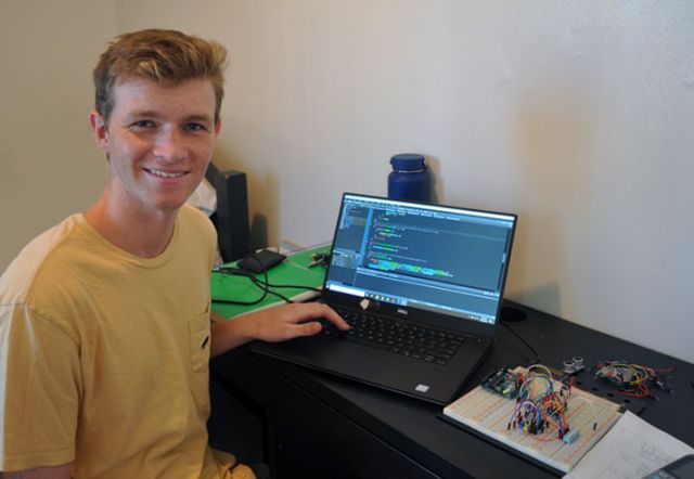 photo of Brycen at his desk