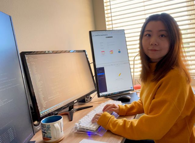 photo of zeng at her desk