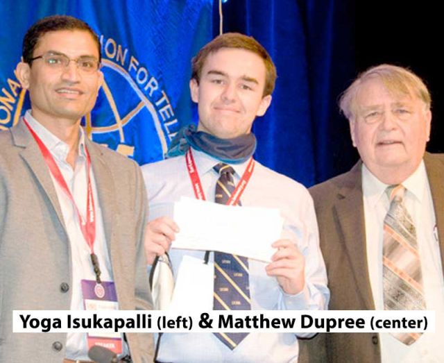 photo of isukapalli and dupree receiving the award