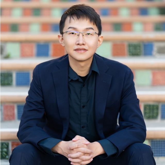 photo of gushu sitting on stairs outside of physical sciences north