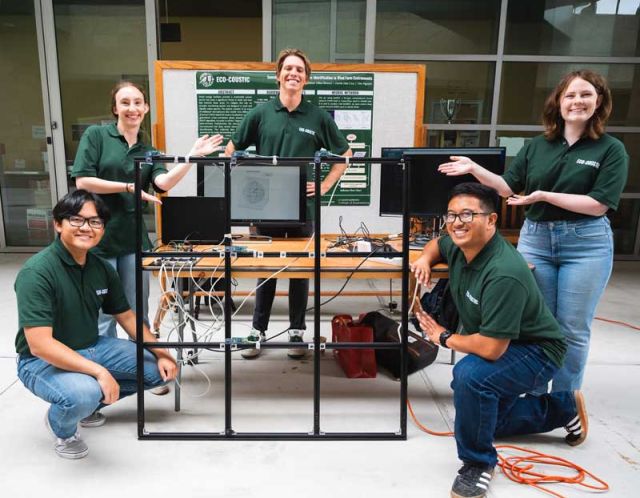 photo of students with their capstone project